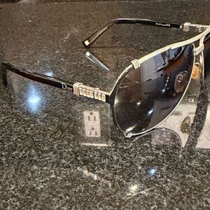Dior Black Sunglasses with Gold Accents and Dark Gradient Lenses